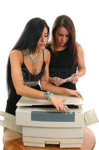 Ремонт оргтехники 1117354-two-women-trying-to-figure-out-how-to-work-the-new-office-copier.jpg